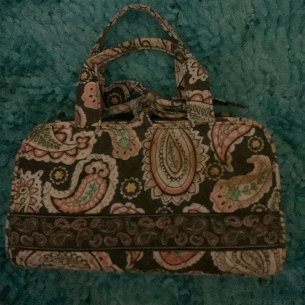 Cosmetic bag with neutral colors tan white,cream brown.